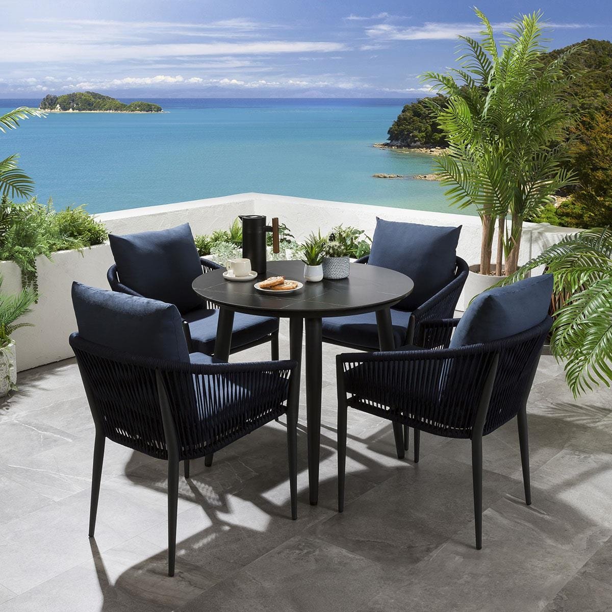 quatropi-cole-4-seater-dining-set-ceramic-black-45330597937446 Hernando Outdoor Garden Patio Dining Set 4 Chairs and 1 Table Set (Blue+Black) Braided & Rope - Image 1